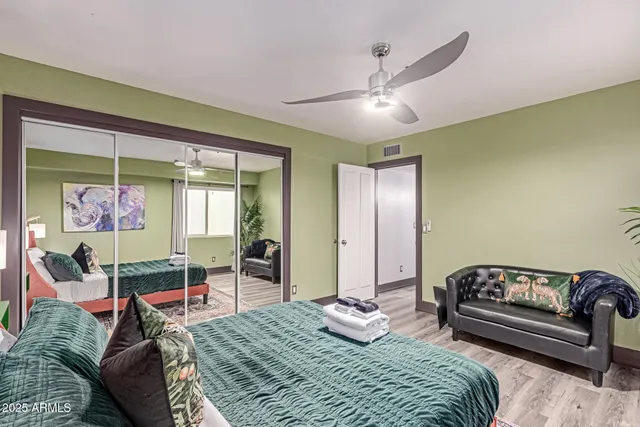 a view of kitchen island with stainless steel appliances granite countertop furniture and a fireplace