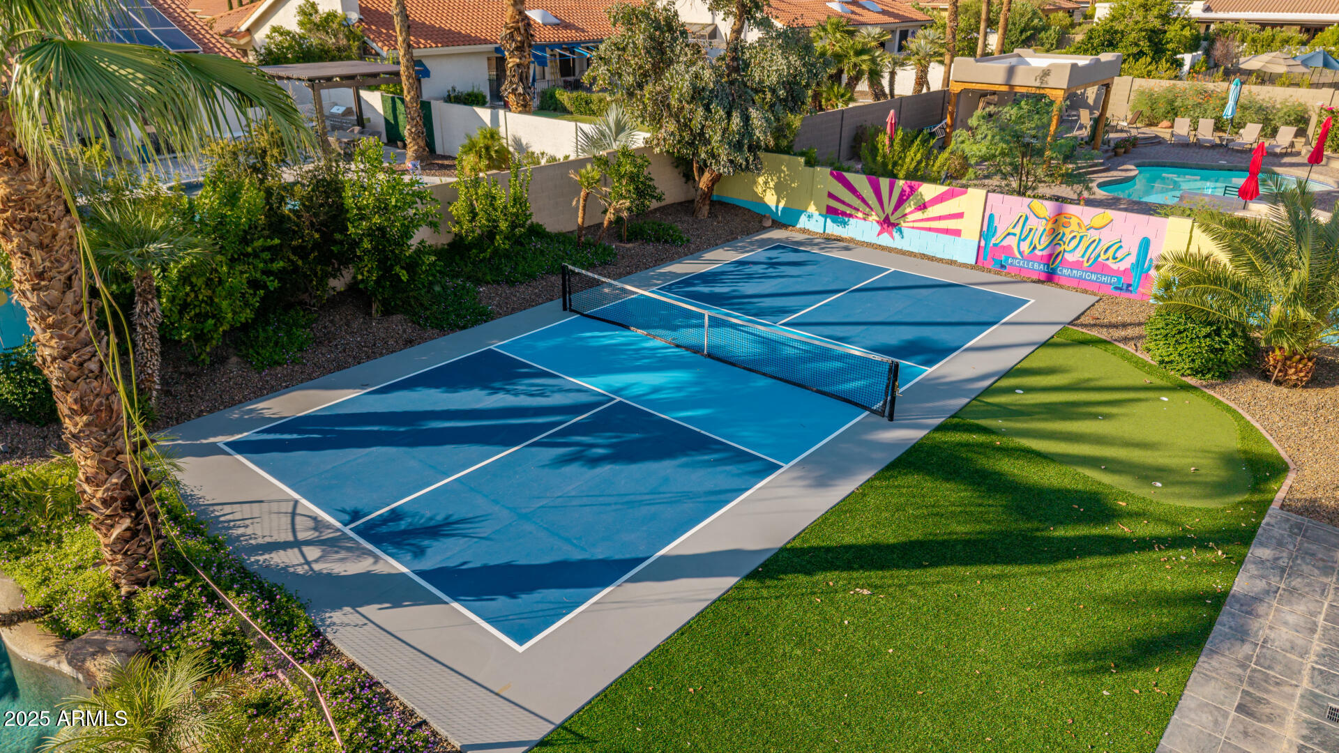 12528 North 78th Street Scottsdale, AZ 85260 - Photo 60 of 62 a view of a tennis ground with large trees