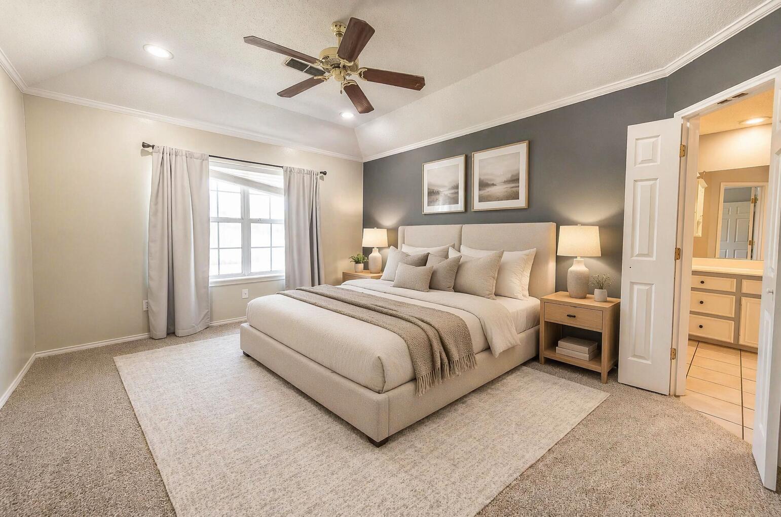 2923 85th Street Lubbock, TX 79423 - Photo 12 of 23 a spacious bedroom with a large bed a chandelier and windows