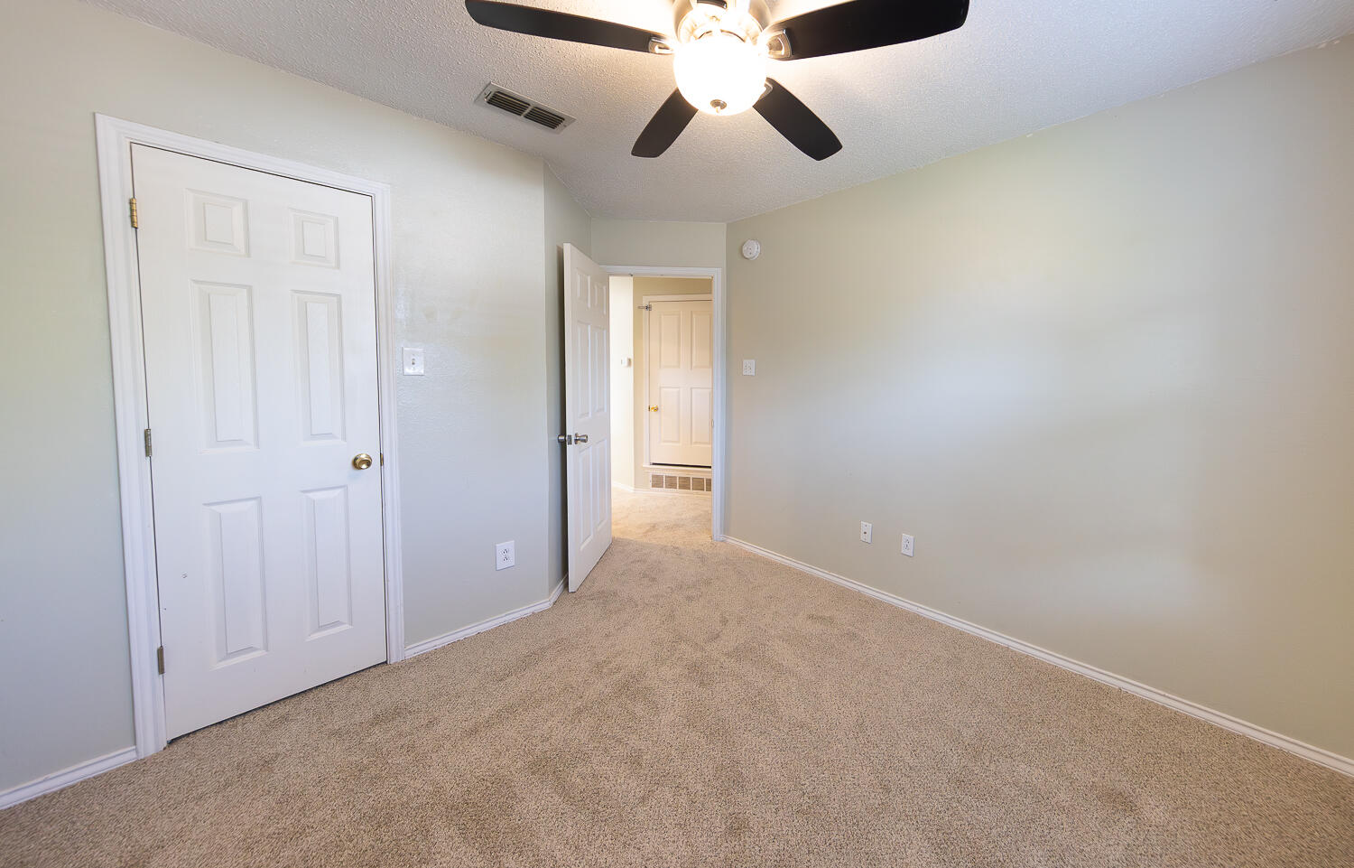 2923 85th Street Lubbock, TX 79423 - Photo 18 of 23 a view of an empty room and chandelier fan
