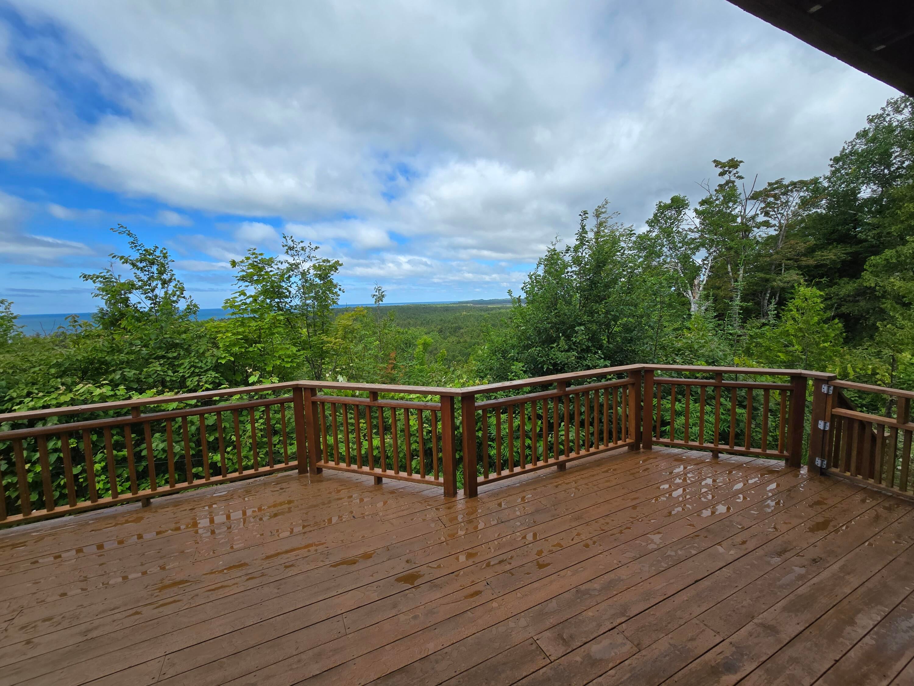N1746 Smith Road St. Ignace, MI 49781 - Photo 36 of 88 Deck Surrounded By Trees
