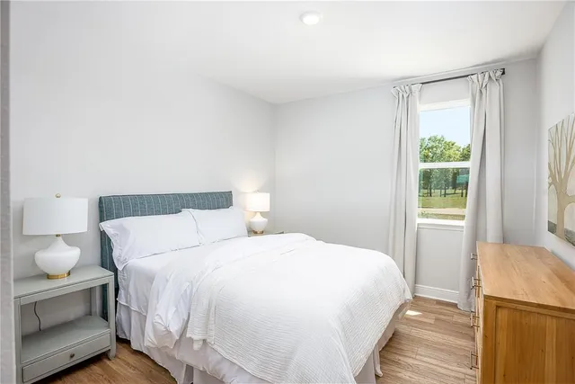 a bedroom with a bed and a couch