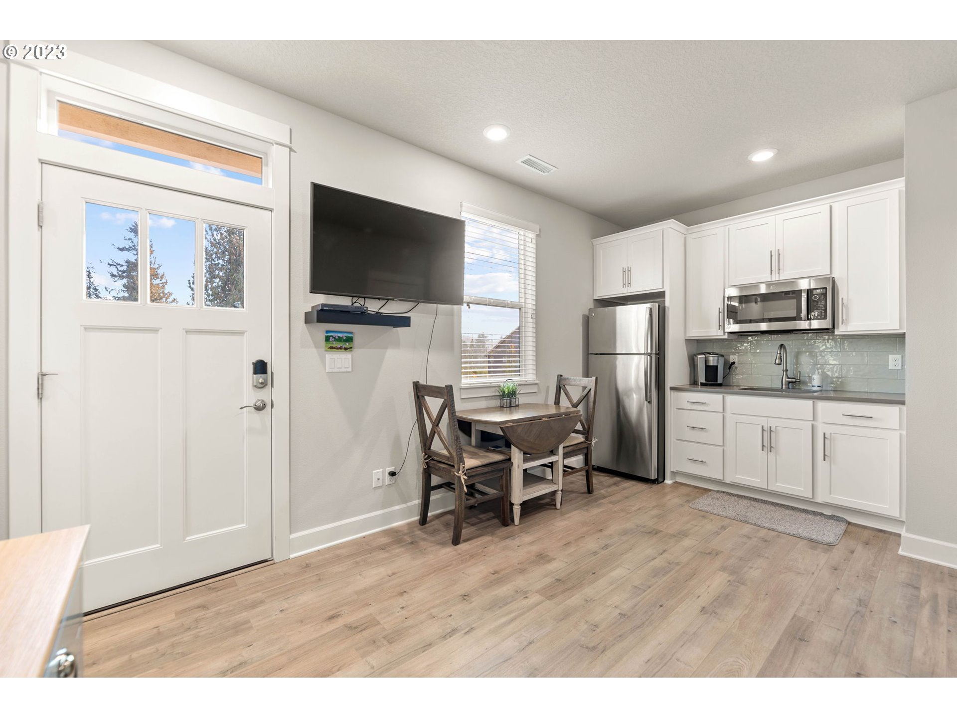 1851 South 47th Place Ridgefield, WA 98642 - Photo 11 of 31 a open kitchen with cabinets refrigerator and a table