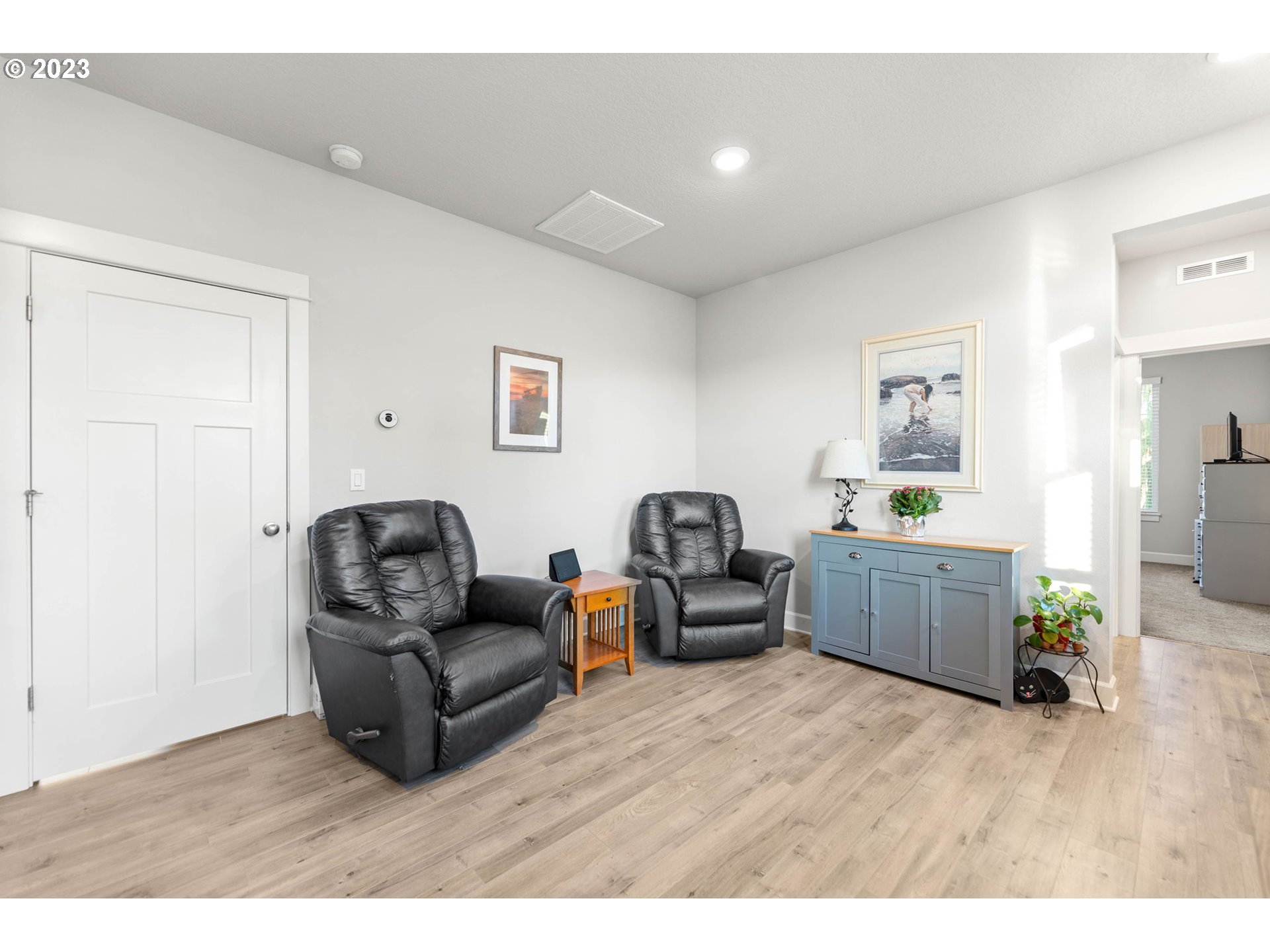 1851 South 47th Place Ridgefield, WA 98642 - Photo 12 of 31 a living room with furniture and a wooden floor