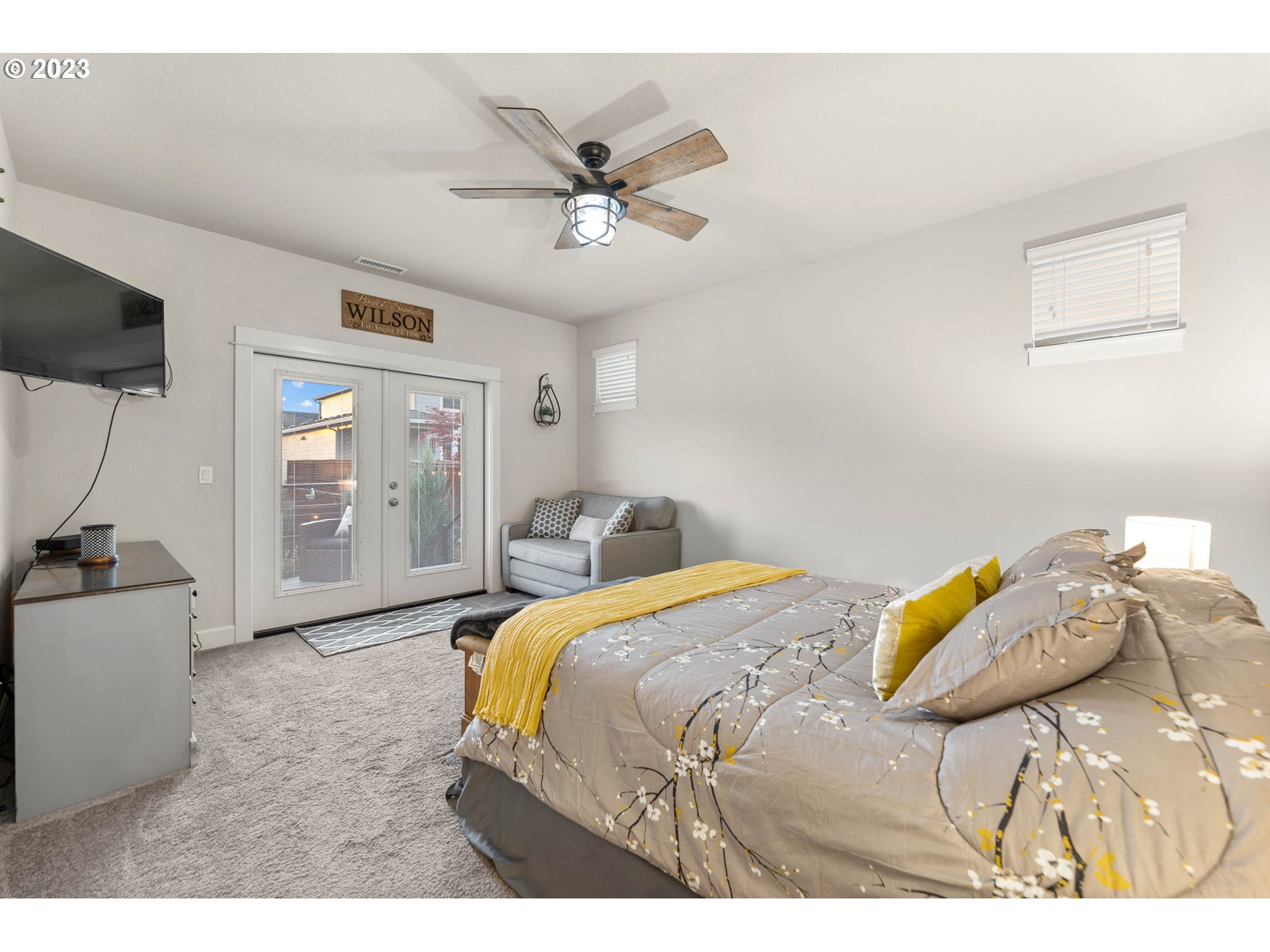 1851 South 47th Place Ridgefield, WA 98642 - Photo 19 of 31 a bedroom with a bed and a chandelier