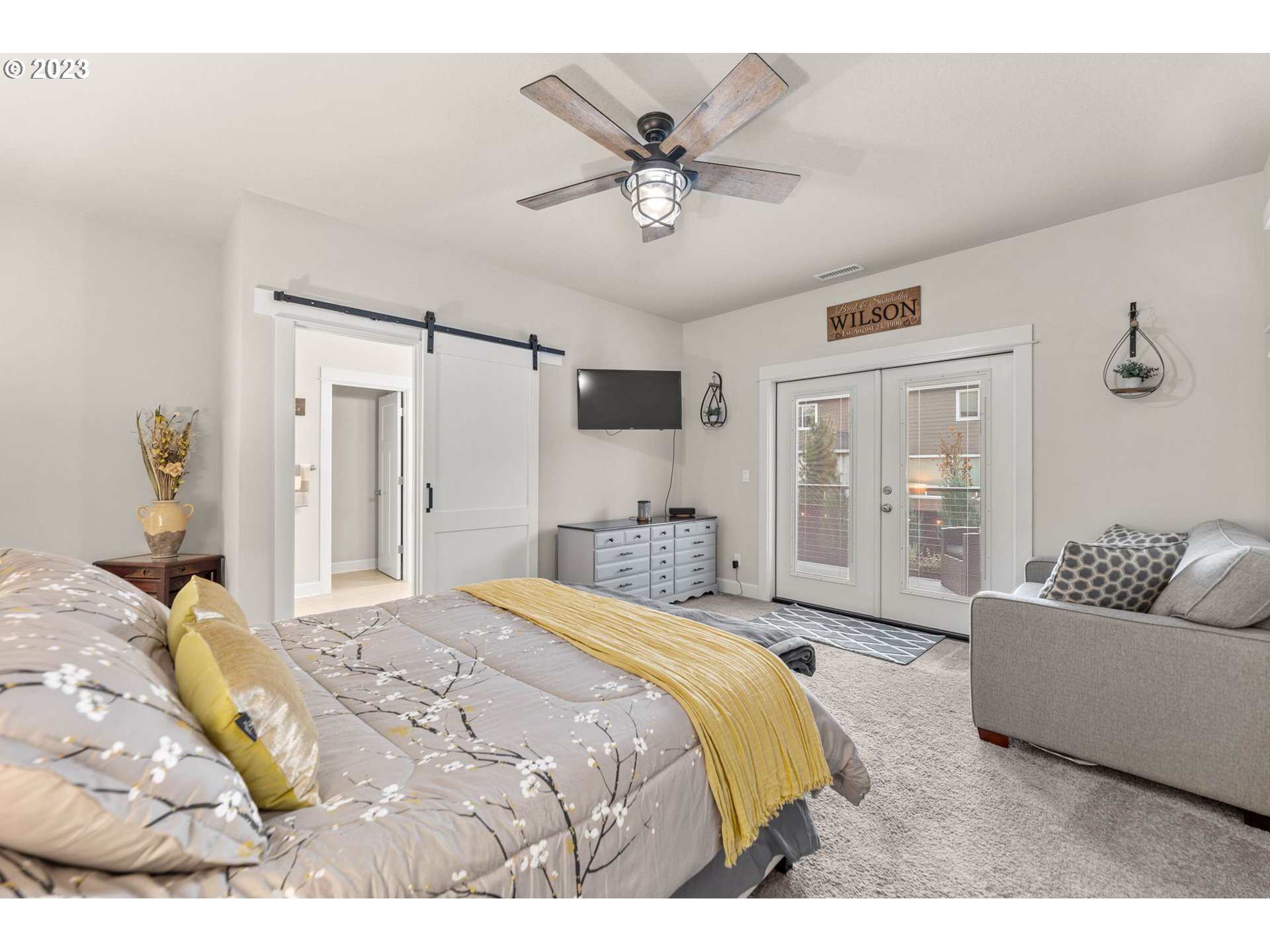 1851 South 47th Place Ridgefield, WA 98642 - Photo 20 of 31 a spacious bedroom with a bed and ceiling fan