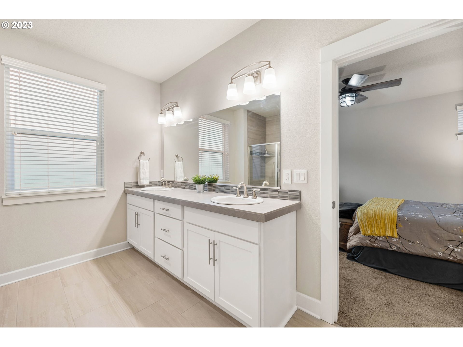 1851 South 47th Place Ridgefield, WA 98642 - Photo 22 of 31 a bathroom with a sink a vanity and a mirror