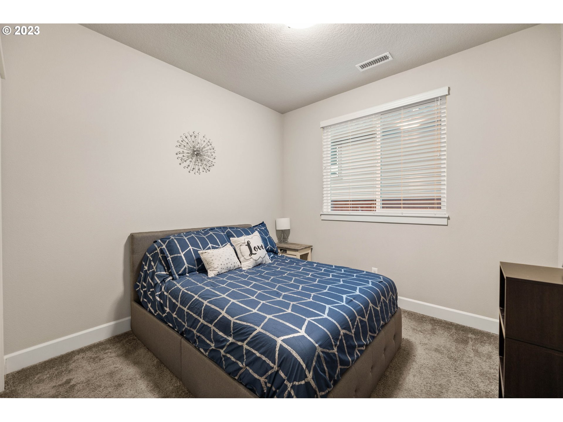 1851 South 47th Place Ridgefield, WA 98642 - Photo 23 of 31 a bedroom with a bed window and lamp