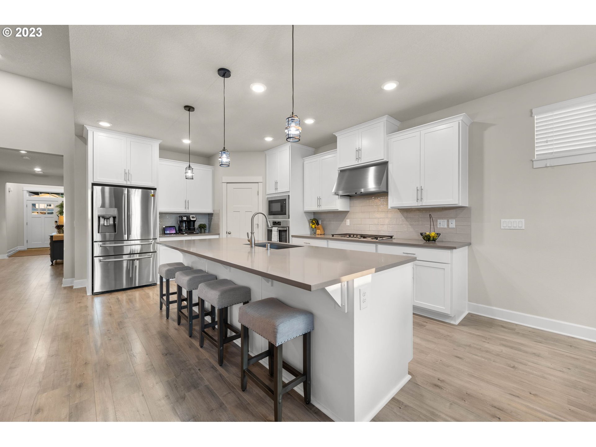 1851 South 47th Place Ridgefield, WA 98642 - Photo 3 of 31 a large kitchen with lots of counter space a sink appliances and cabinets