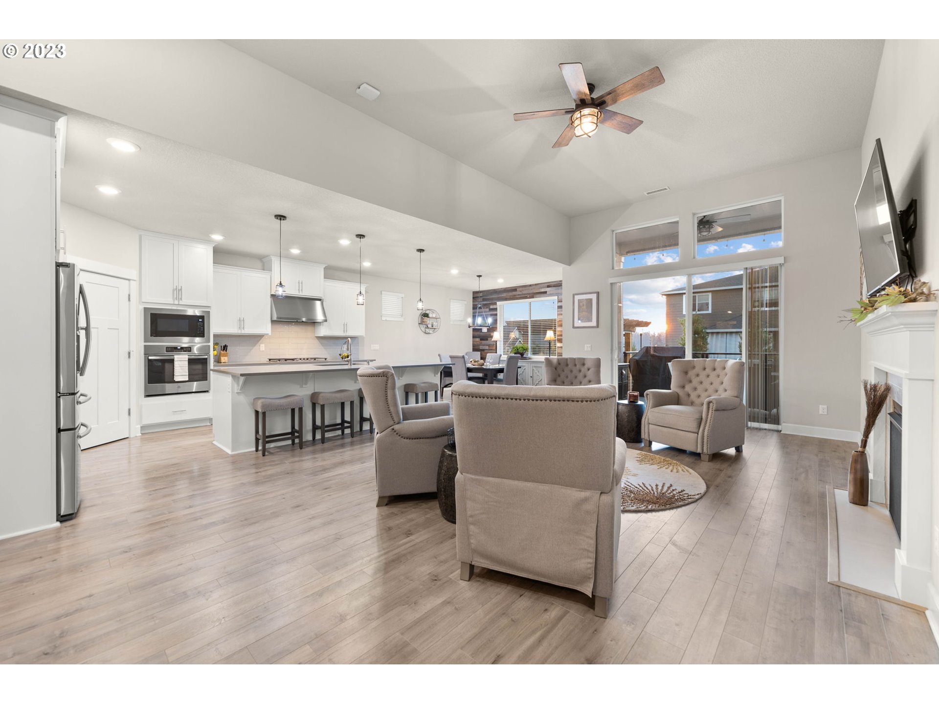 1851 South 47th Place Ridgefield, WA 98642 - Photo 8 of 31 a living room with stainless steel appliances kitchen island furniture and a view of kitchen