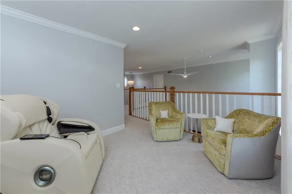 a living room with furniture and a rug