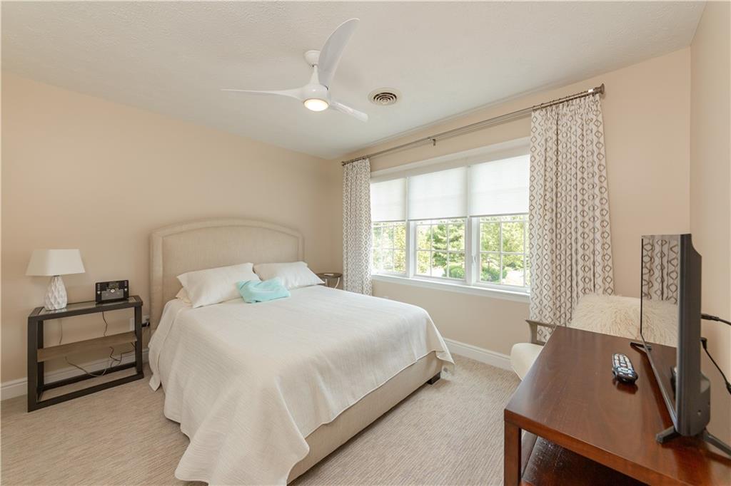 100 Prestonwood Lane Canonsburg, PA 15317 - Photo 21 of 33 a bedroom with a bed and a flat tv screen on a dresser