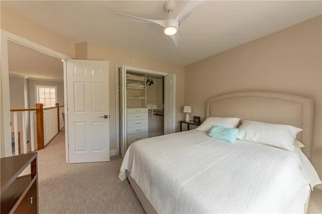 a bedroom with a bed and a mirror