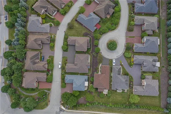 an aerial view of residential house with outdoor space and parking