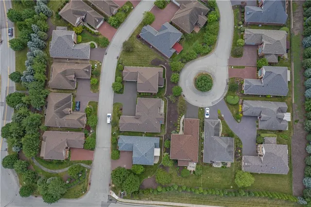 an aerial view of residential house with outdoor space and parking