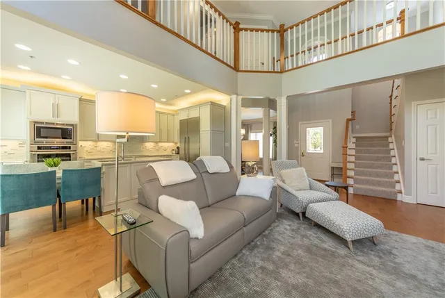 a living room with furniture and kitchen view