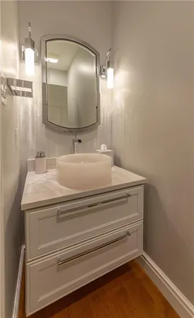 a bathroom with a sink and a mirror