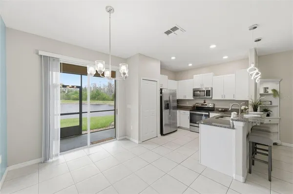 a view of a swimming pool with a patio