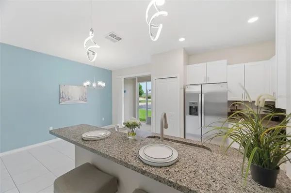 a view of a balcony with wooden floor and fence