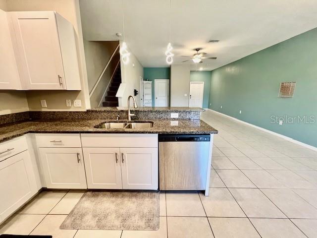 8606 Reedville Street New Port Richey, FL 34654 - Photo 23 of 85 a kitchen with granite countertop white cabinets and white appliances