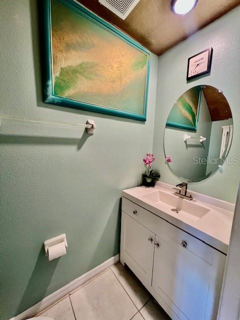 8606 Reedville Street New Port Richey, FL 34654 - Photo 25 of 85 a bathroom with a sink and mirror