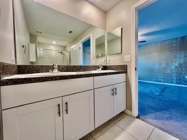 a view of a house with a yard and plants