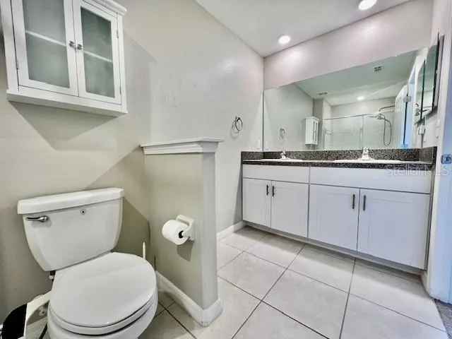 a view of a lake in between two chairs