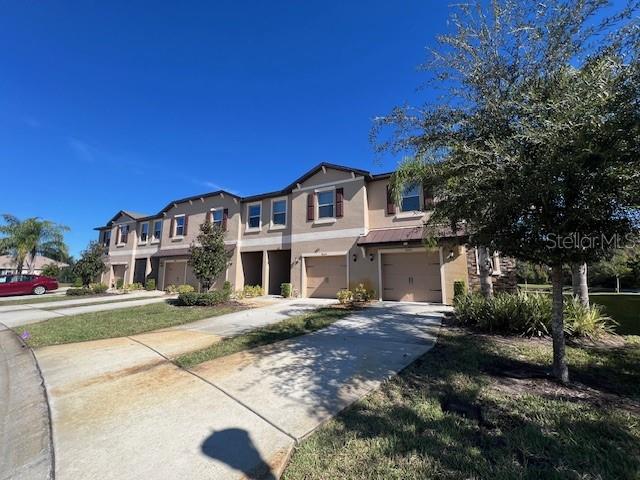 8606 Reedville Street New Port Richey, FL 34654 - Photo 4 of 85 a front view of a house with a garden