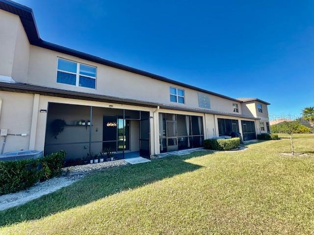 8606 Reedville Street New Port Richey, FL 34654 - Photo 53 of 85 a view of a house with a yard and plants