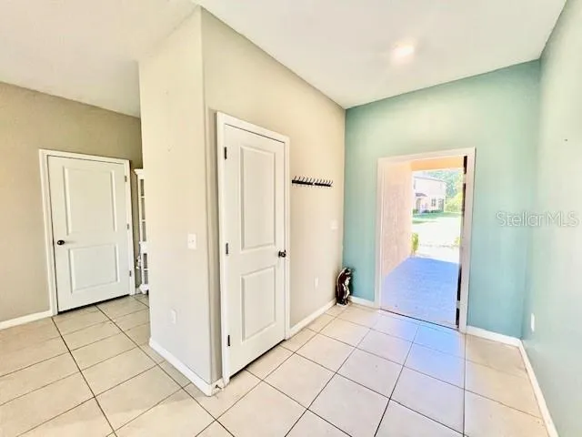 a view of a electric appliances and windows in a room