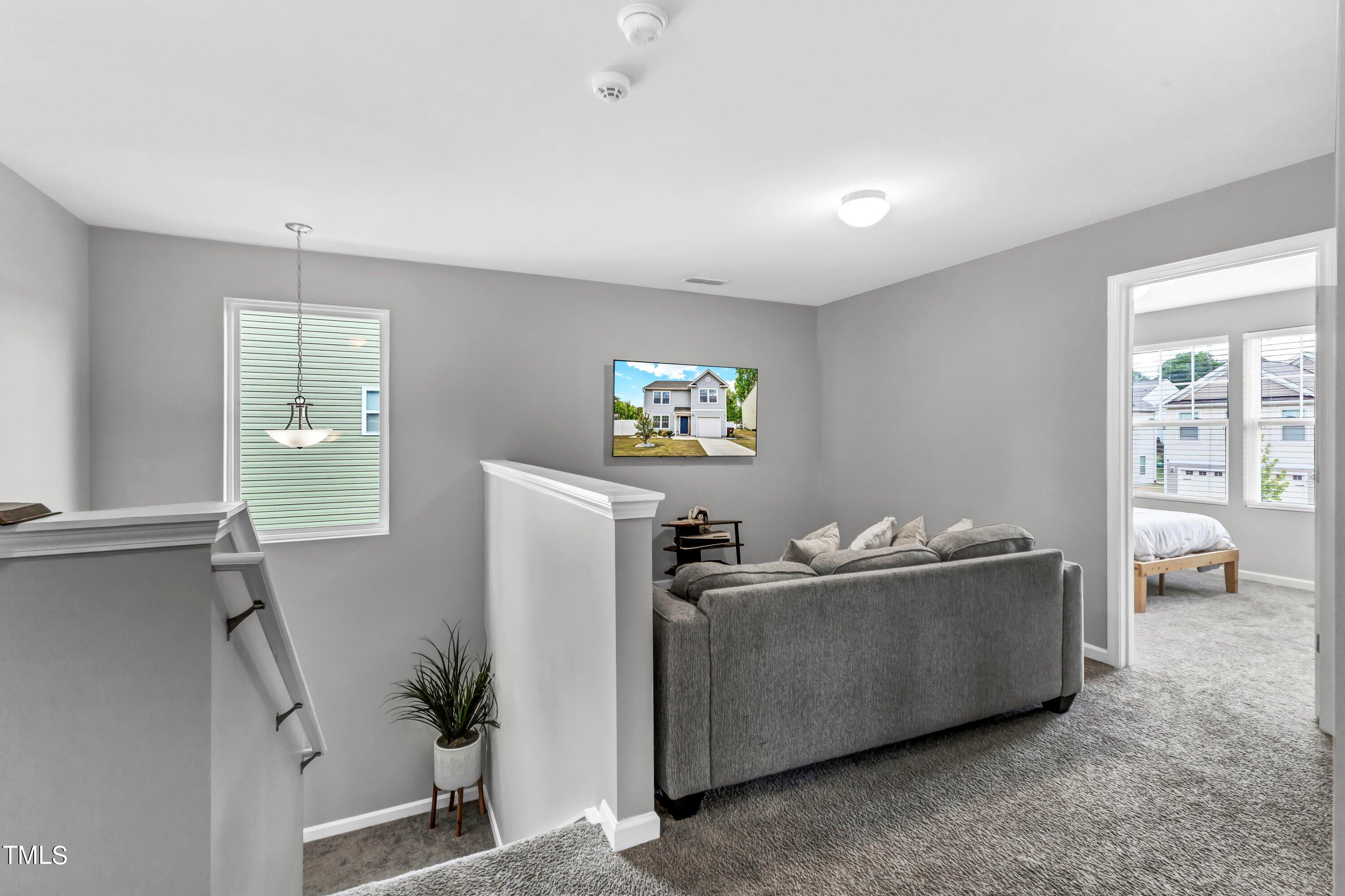 301 Connect Drive Wendell, NC 27591 - Photo 16 of 28 a living room with furniture and a window