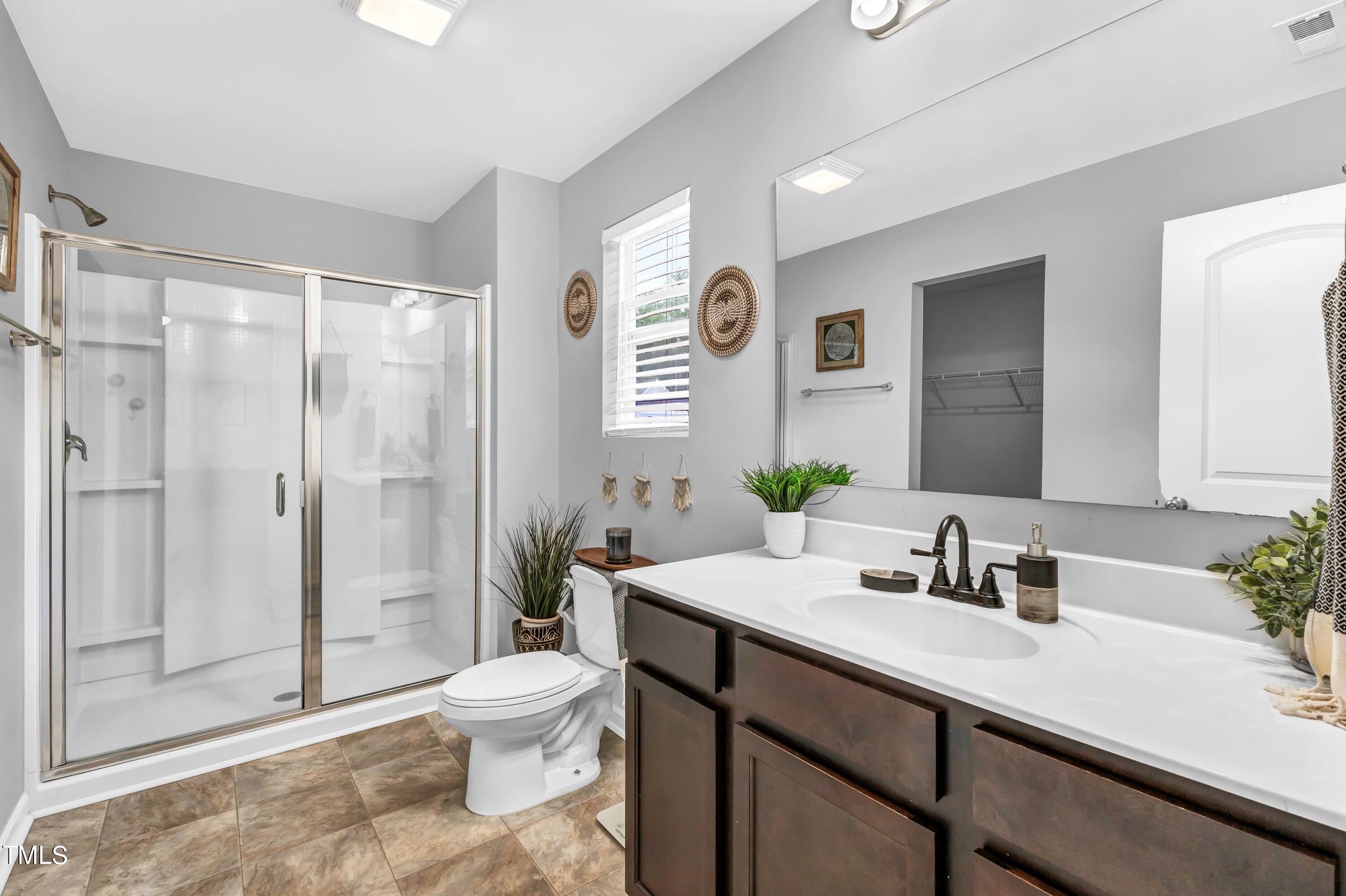 301 Connect Drive Wendell, NC 27591 - Photo 20 of 28 a bathroom with a sink a toilet and shower
