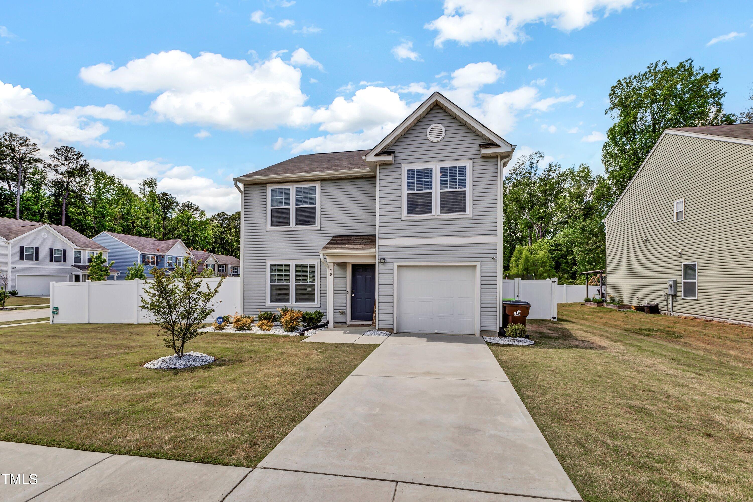 301 Connect Drive Wendell, NC 27591 - Photo 2 of 28 a front view of a house with a yard