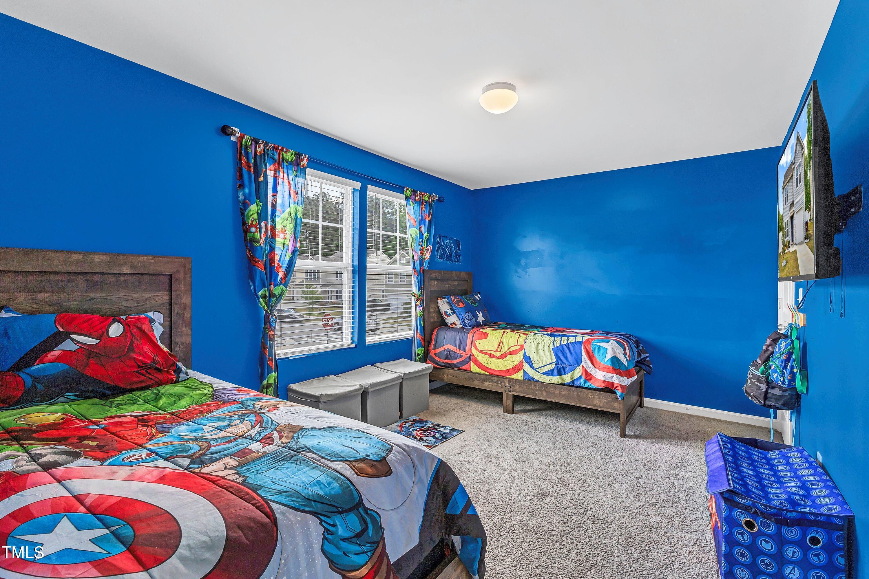 301 Connect Drive Wendell, NC 27591 - Photo 23 of 28 a bedroom with a bed and a couch