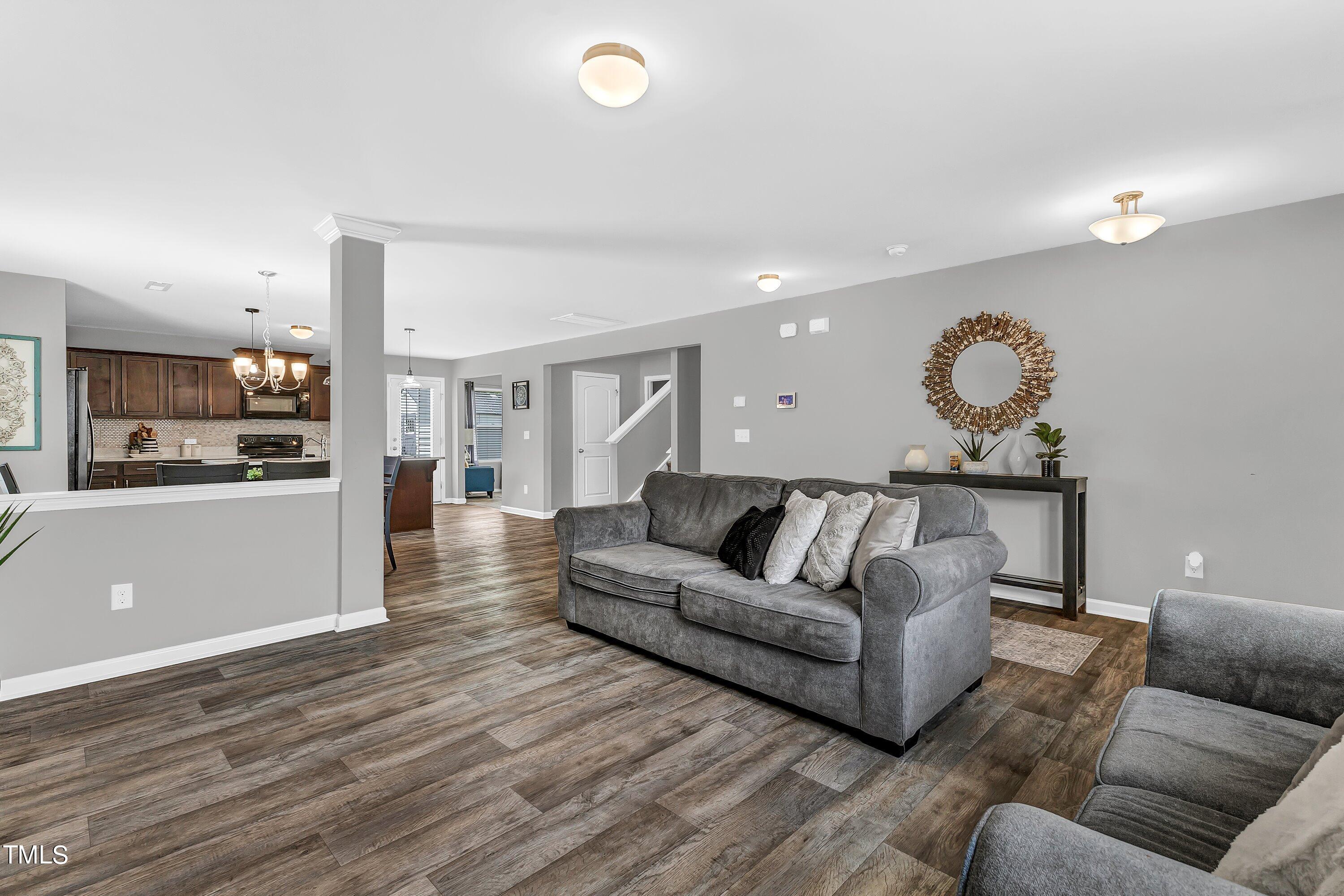 301 Connect Drive Wendell, NC 27591 - Photo 7 of 28 a living room with furniture and a wooden floor