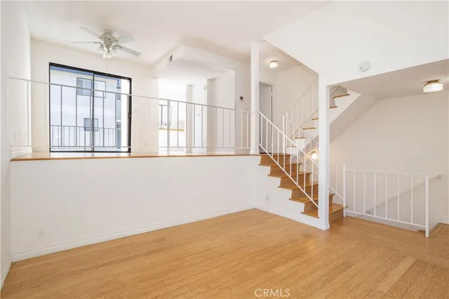 a view of an entryway with wooden floor