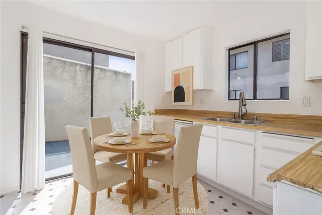 a view of a dining room with furniture and window