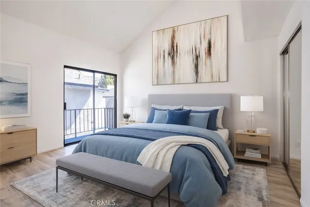 a spacious bedroom with a bed and a window