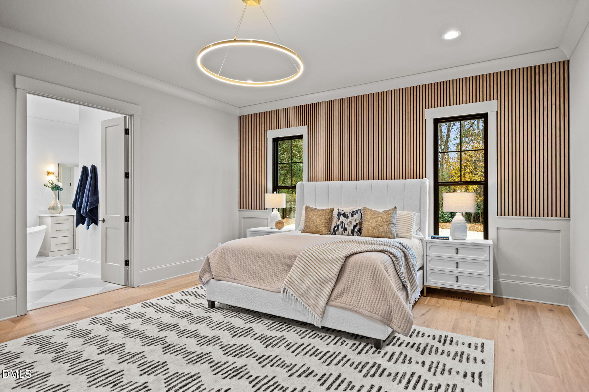 1318 Ivy Lane Raleigh, NC 27609 - Photo 22 of 61 a bedroom with a large bed and a chandelier