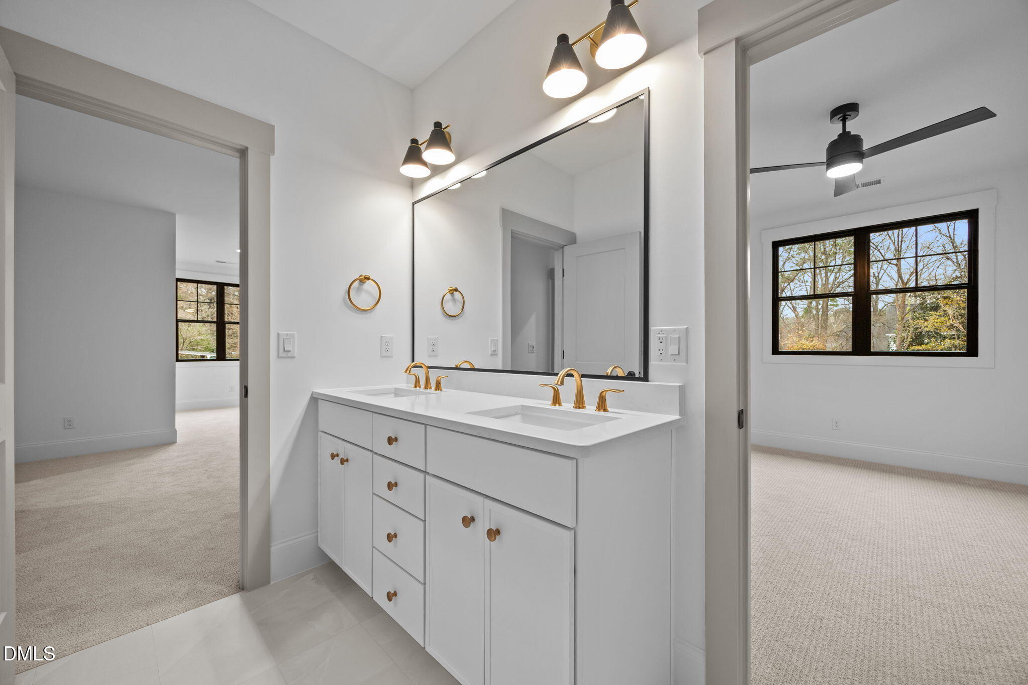 1318 Ivy Lane Raleigh, NC 27609 - Photo 35 of 61 a bathroom with a double vanity sink and a mirror