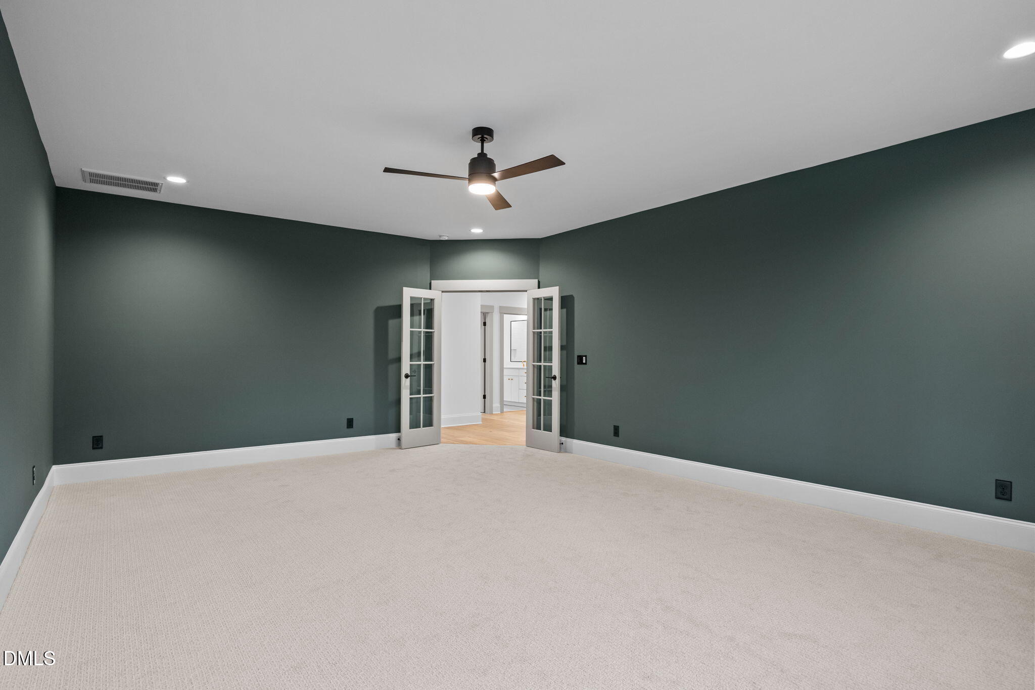 1318 Ivy Lane Raleigh, NC 27609 - Photo 43 of 61 a view of an empty room with a ceiling fan