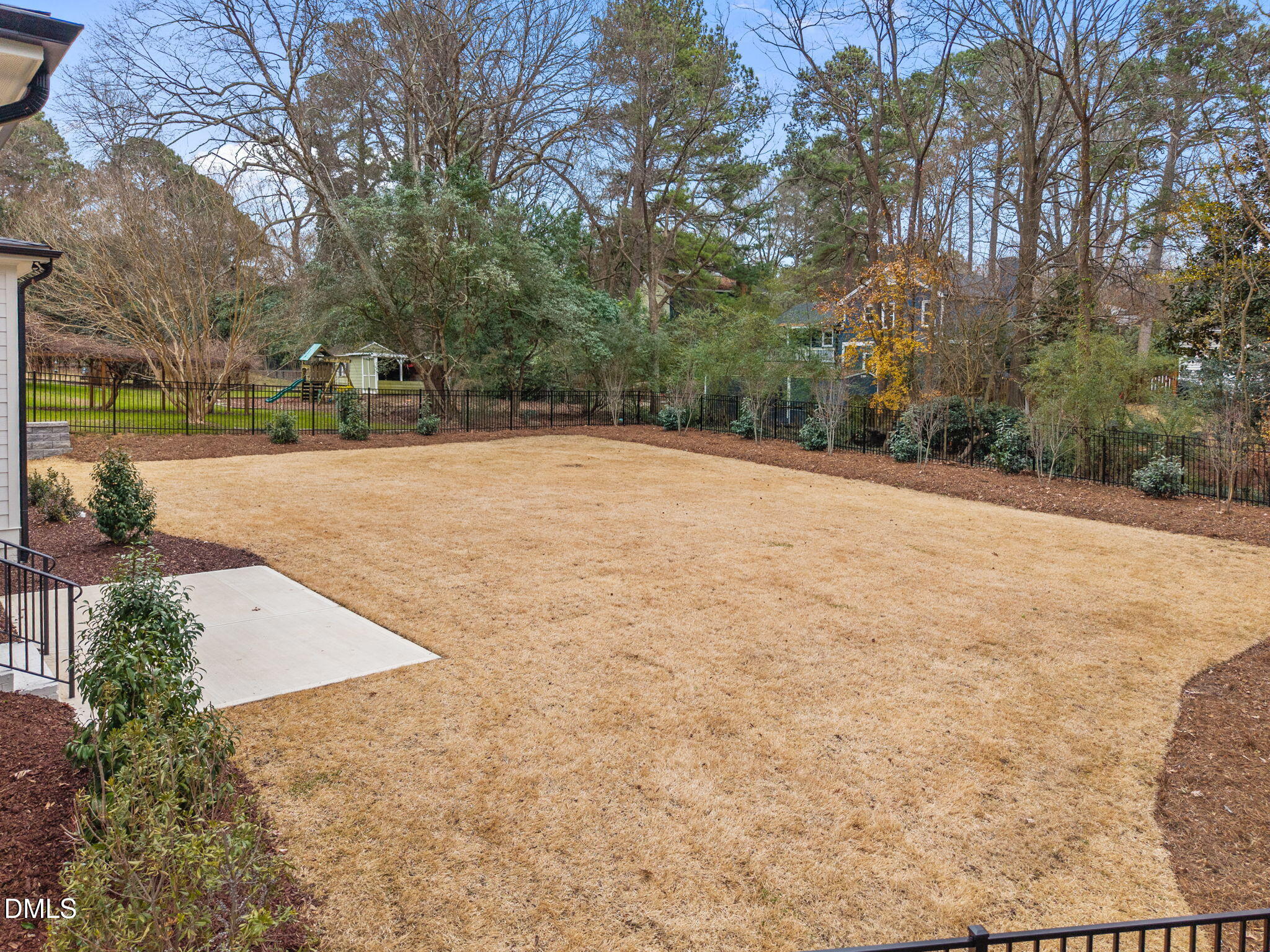 1318 Ivy Lane Raleigh, NC 27609 - Photo 51 of 61 a backyard of a house with lots of green space