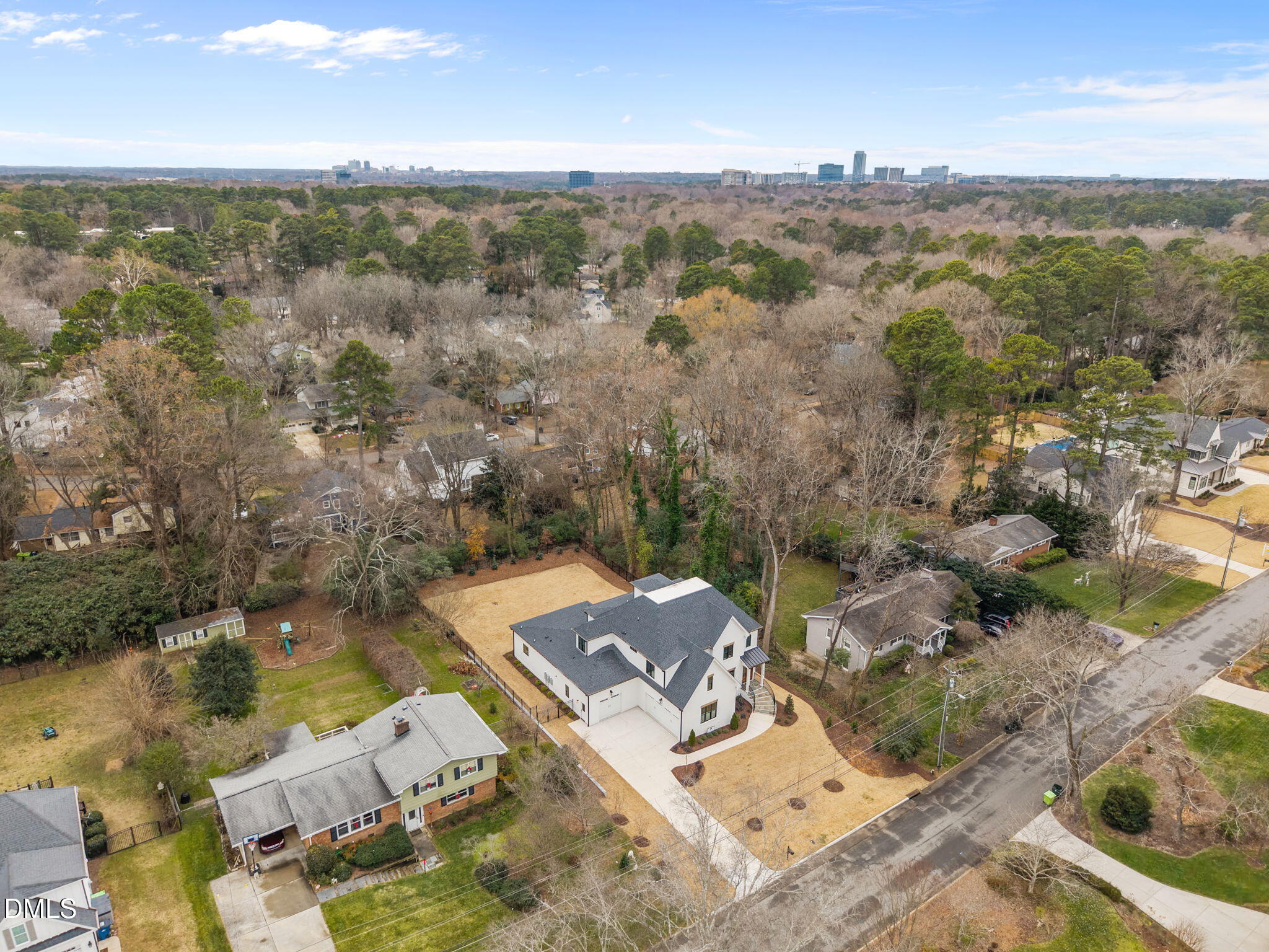 1318 Ivy Lane Raleigh, NC 27609 - Photo 57 of 61 an aerial view of a house with a lake view