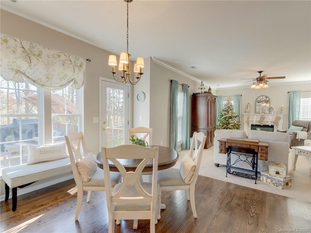 3028 Strawberry Road Matthews, NC 28104 - Photo 13 of 44 a view of a dining room with furniture window and outside view