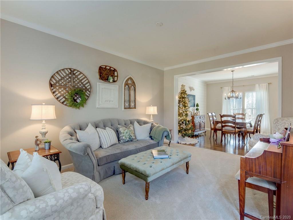 3028 Strawberry Road Matthews, NC 28104 - Photo 15 of 44 a living room with furniture and wooden floor