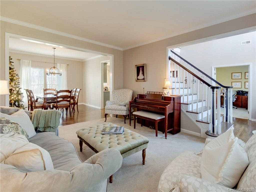3028 Strawberry Road Matthews, NC 28104 - Photo 16 of 44 a living room with furniture and wooden floor