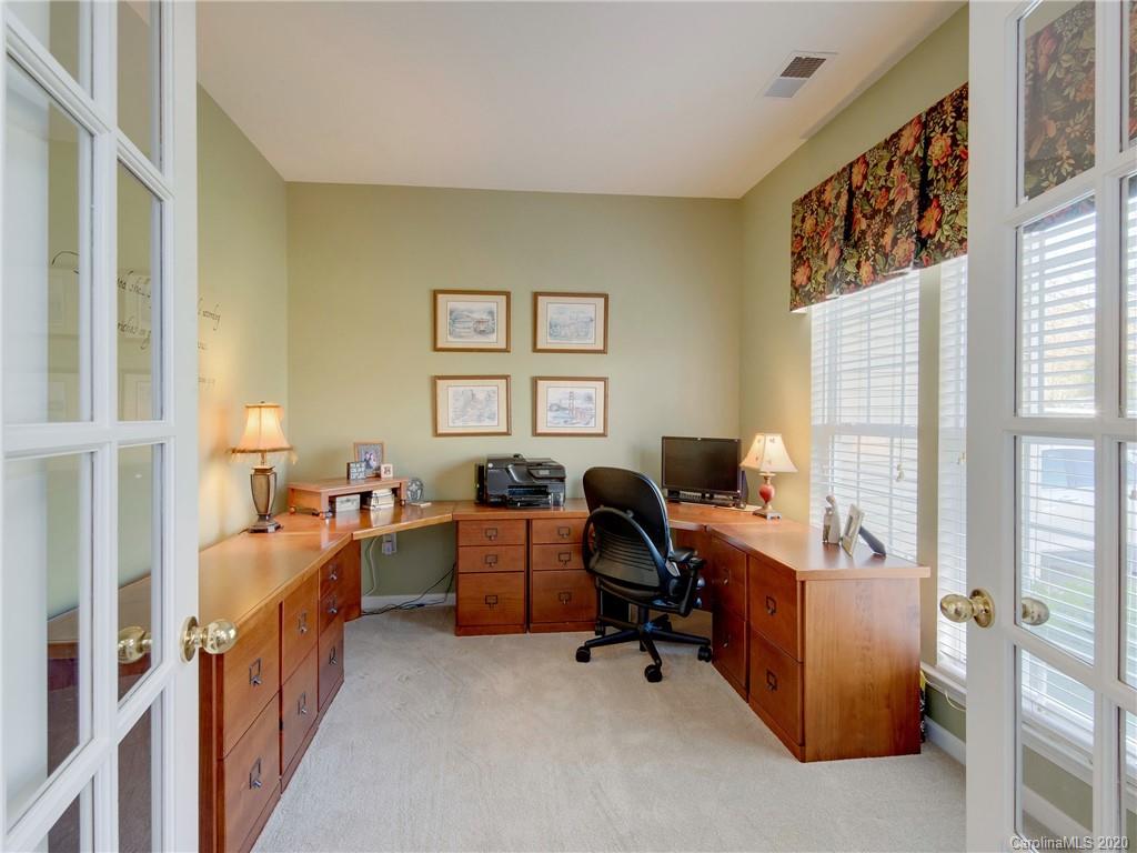 3028 Strawberry Road Matthews, NC 28104 - Photo 18 of 44 a view of a workspace with furniture and a window