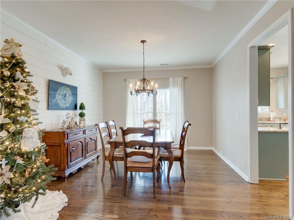 3028 Strawberry Road Matthews, NC 28104 - Photo 19 of 44 a view of a a dining room with furniture window and wooden floor