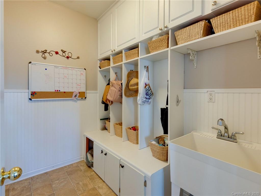 3028 Strawberry Road Matthews, NC 28104 - Photo 20 of 44 a bathroom with a tub sink and mirror
