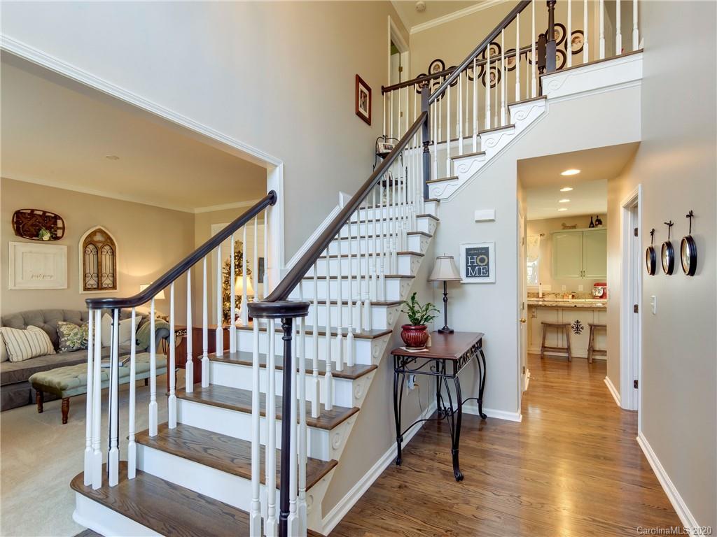 3028 Strawberry Road Matthews, NC 28104 - Photo 3 of 44 a view of entryway and hall with wooden floor
